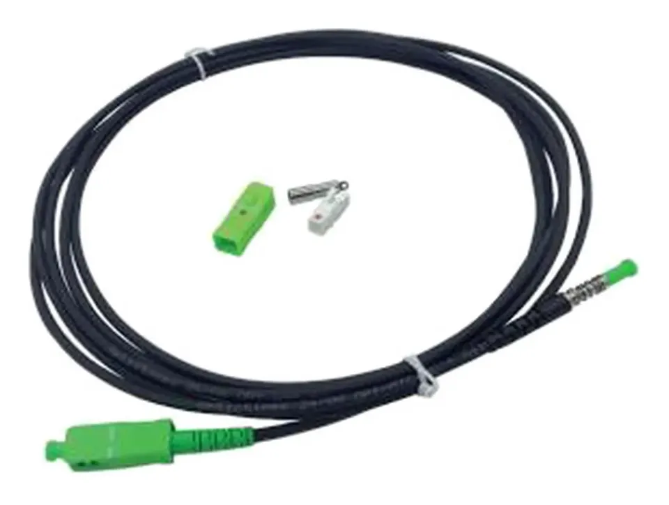 Armoured black SC/APC patch cord with spare boot on a plain background